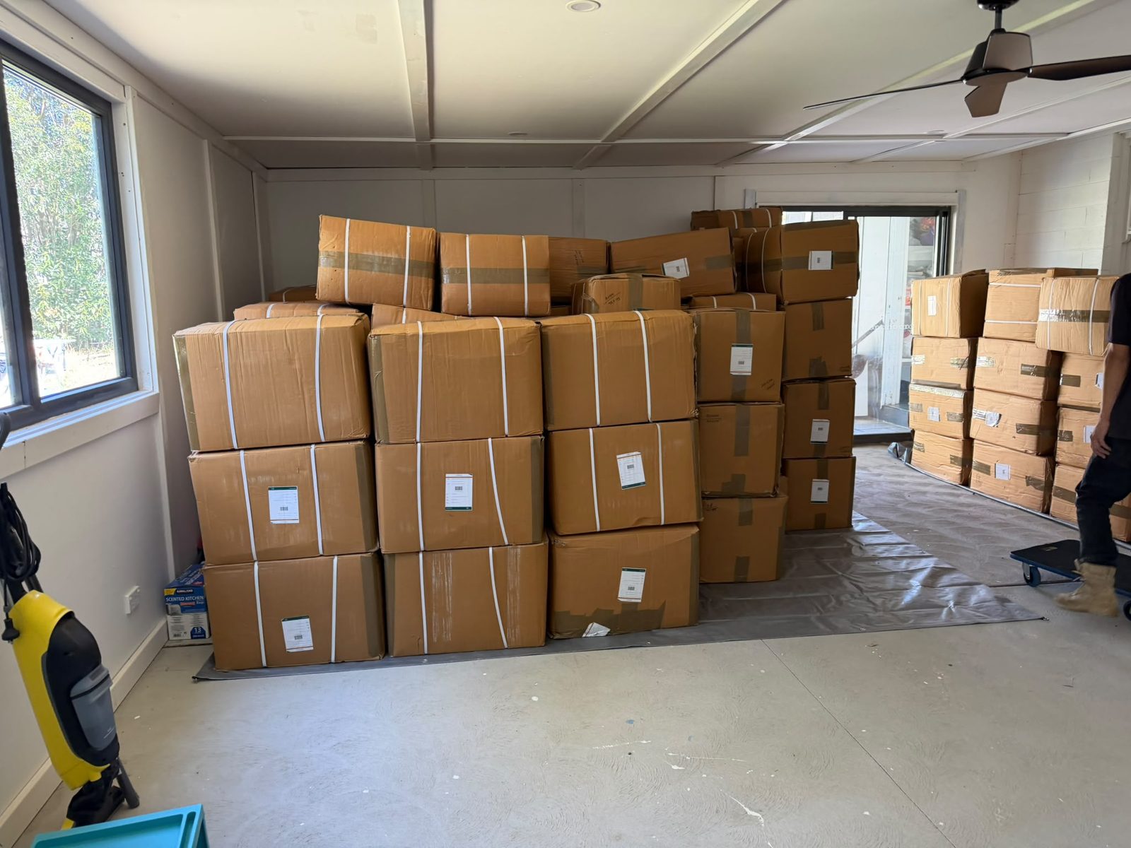 Packed boxes stacked in a room on an RB Removals job