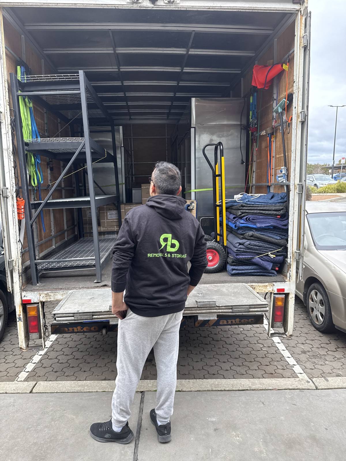 RB Removals crew member at the back of a loaded truck
