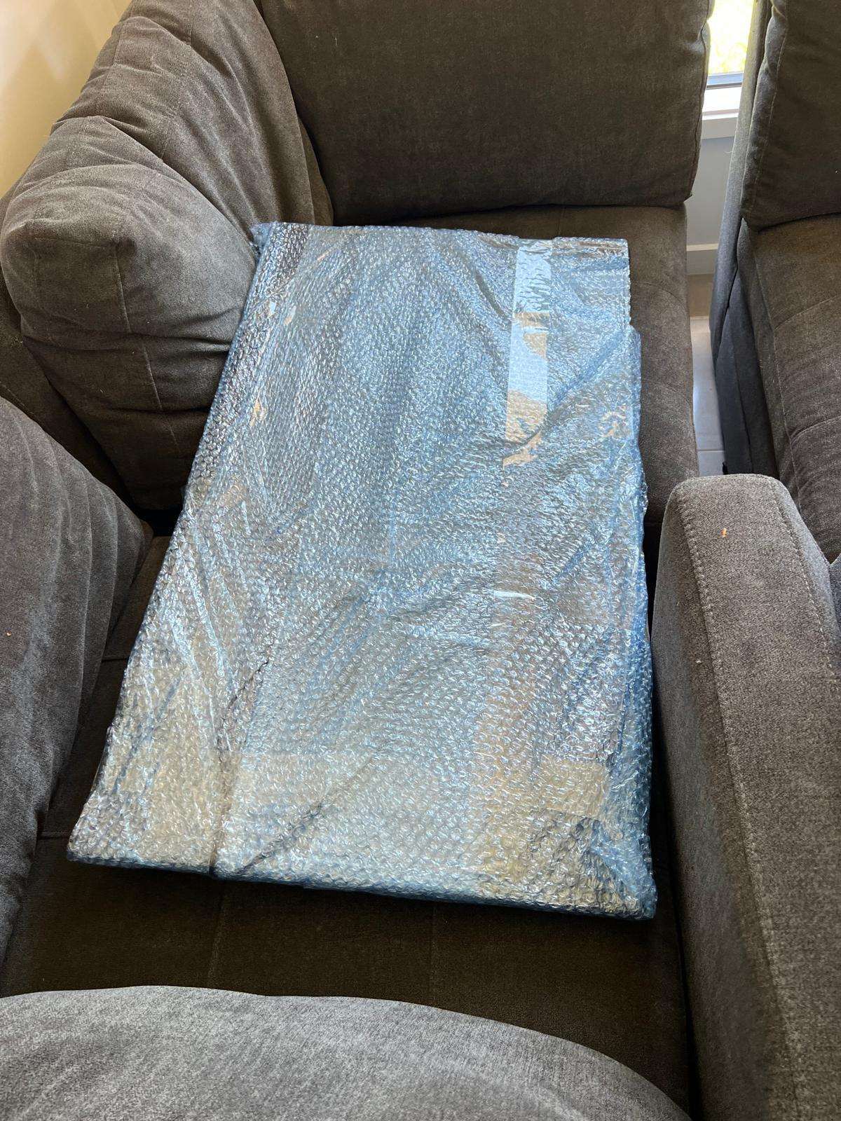 Glass table top wrapped in bubble wrap